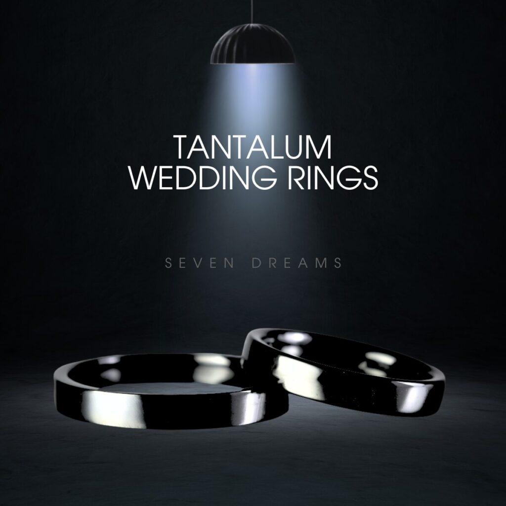 タンタル製の黒い結婚指輪が照明の中で輝いているイメージ